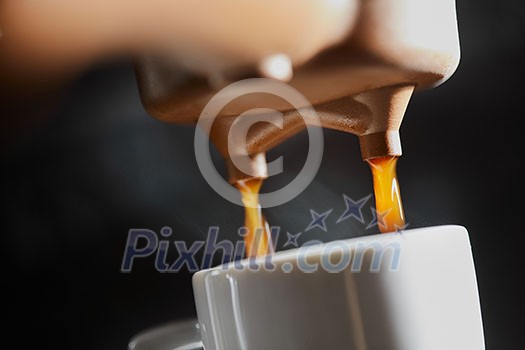 Making fragrant morning coffee in the coffee machine. Macro photo