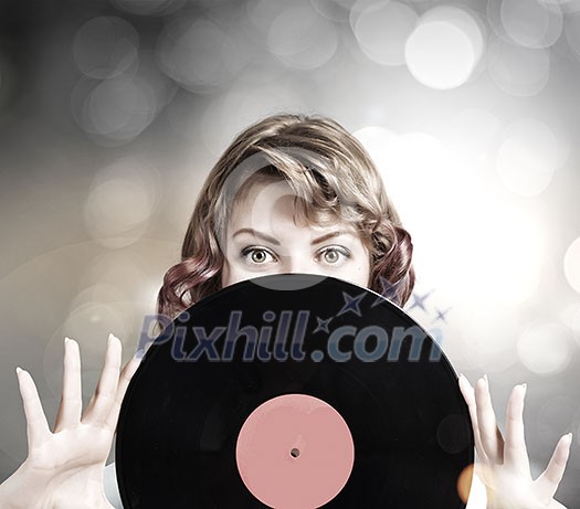 Young woman in casual holding disco plate Young woman in casual holding disco plate