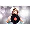Young woman in casual holding disco plate on bokeh background