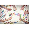 Top view of people hand drawing business creative concept with paints
