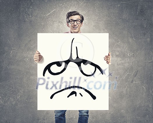 Businessman hold white board with sad face emoticon Businessman hold white board with sad face emoticon