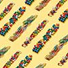 Diagonal multicolored collection of stationery strips paperclips and pins on an yellow background with copy space. Back to school concept.