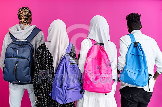 Group Portrait Of University Students african girls wearing traditional islamic scarf veil with plastic pink background