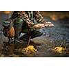 Close-up view of the hands of a fly fisherman holding a lovely trout while  fly fishing on a splendid mountain river