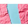 Handmade multicolored backdrop from crumpled hot pink paper on a blue background with copy space. Can be used for your creativity.