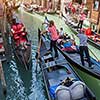 Several gondolas with gondoliers in Venice, Italy. Beautiful view on Grand Canal.