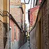 Venetian buildings represented onnarrow street in Italy. Narrow road in Venice, Italy.
