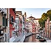 Venice, Italy. Grand Canal and historic tenements. Beautiful view of Grand Canal and multicoloured old medival buildings.