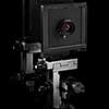 Vintage retro old-fashioned photo camera on a black background with copy space.