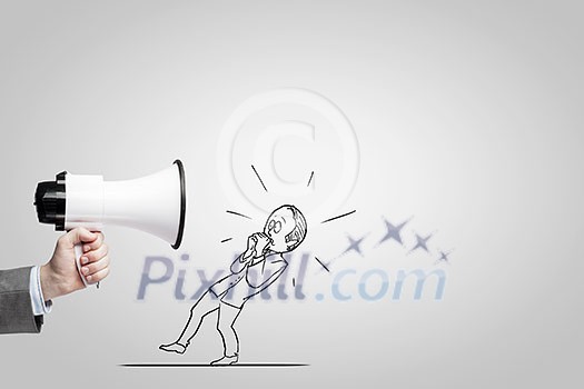 Close up of businessman hand holding megaphone