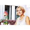 Portrait of young pretty woman sitting at cafe