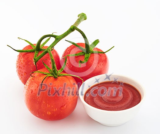 Freshly prepared ketchup with ripe red tomatoes on a white background