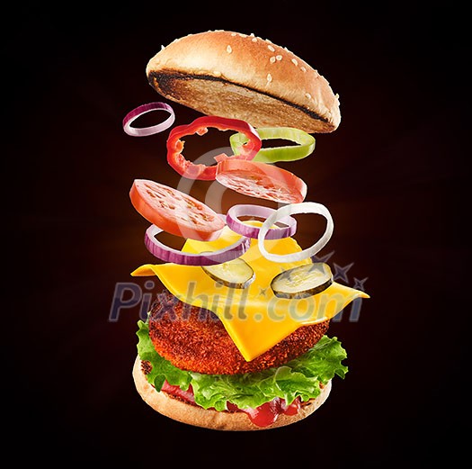 Burger with flying ingredients. Delicious monster Hamburger cheeseburger explosion concept flying ingredients. Burger with flying ingredients. Delicious monster Hamburger cheeseburger explosion concept flying ingredients.