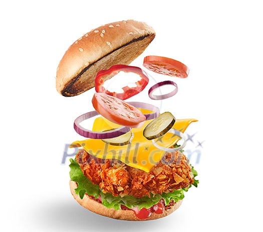 Burger with flying ingredients. Delicious monster Hamburger cheeseburger explosion concept flying ingredients. Isolated on white.