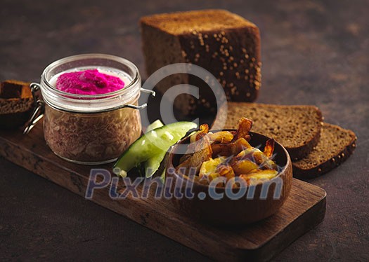 Beef aspic with baked potatoes, pickled cucumber and rye bread Beef aspic with baked potatoes, pickled cucumber and rye bread