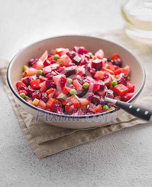 Beet salad Vinaigrette. Russian salad with oil and vinegar. Cold dish of finely chopped vegetables, meat or fish, eggs with spicy sauce.