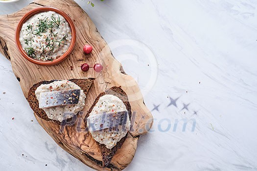 Forshmak - traditional Jewish cuisine. Sandwich with minced herring fillets with apple, onion and egg. Copyspace for text.