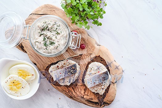 Forshmak - traditional Jewish cuisine. Sandwich with minced herring fillets with apple, onion and egg. Copyspace for text. Forshmak - traditional Jewish cuisine. Sandwich with minced herring fillets with apple, onion and egg. Copyspace for text.