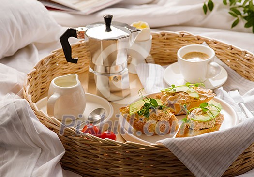 Breakfast in bed in hotel room. A romantic breakfast for your beloved.