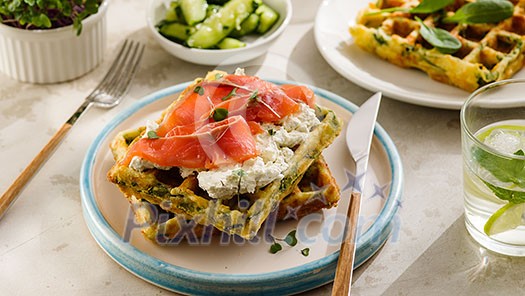 Belgian waffles with cheese and salmon. Healthy breakfast with ricotta and fish. Belgian waffles with cheese and salmon. Healthy breakfast with ricotta and fish.