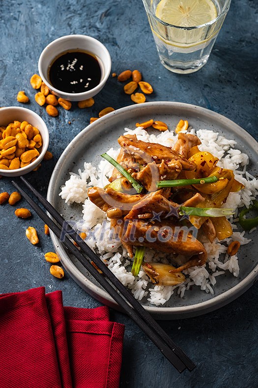 Kung Pao chicken, stir-fried Chinese sichuan traditional sichuan dish with chicken, peanuts, vegetables and chili peppers. Kung Pao chicken, stir-fried Chinese sichuan traditional sichuan dish with chicken, peanuts, vegetables and chili peppers.