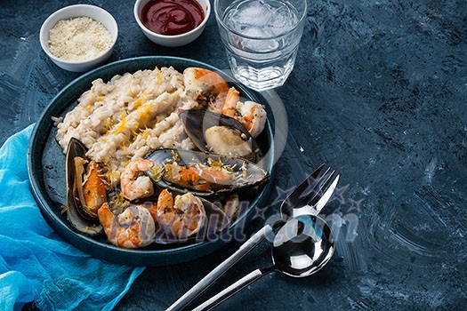 Risotto with seafood. Rice with shrimps and mussels. Mediterranean cuisine.