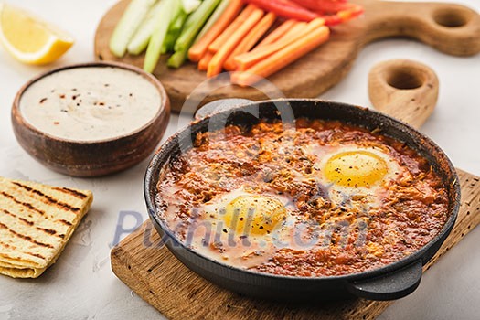 Shakshuka, Fried Eggs in Tomato Sauce. Traditional Mediterranean Fried Eggs. Israeli cuisine