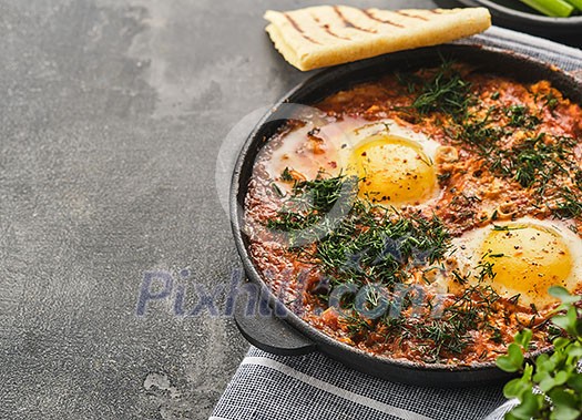 Shakshuka, Fried Eggs in Tomato Sauce. Traditional Mediterranean Fried Eggs. Israeli cuisine