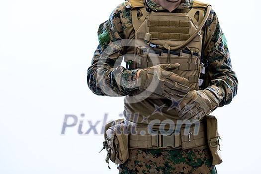closeup of modern warfare soldier hands putting protective battle gloves white background closeup of modern warfare soldier hands putting protective battle gloves white background