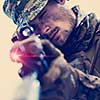 modern warfare american marines soldier aiming  on laseer sight optics  in combat position and searching for target glitch effect