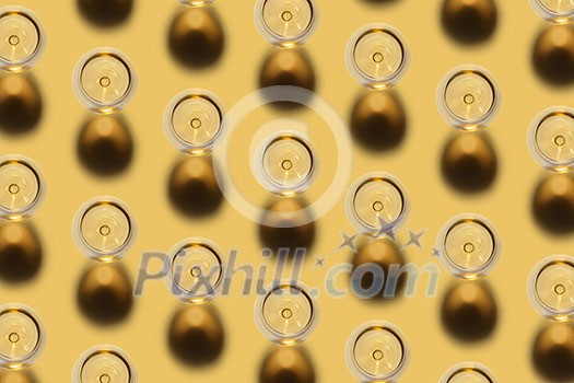 Diagonal pattern from glasses with white dry alcohol wine on a pastel yellow background with dark shadows. Top view.