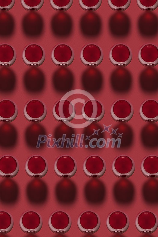 Geometric pattern from glasses with red wine alcoholic drink on a red background with hard shadows. Top view.