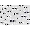 Googly plastic eyes pattern on a light grey backgroud. Used for imitation of eyeballs for handcraft toys and dolls and others creativity. Flat lay.