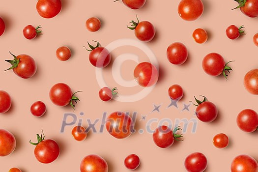 Vegetable pattern from freshly picked natural organic ripe healthy tomatoes cherry on a light beige background with soft shadows. Top view. Vegetable pattern from freshly picked natural organic ripe healthy tomatoes cherry on a light beige background with soft shadows. Top view.