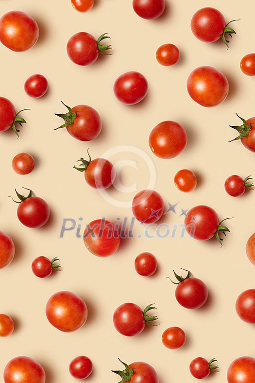 Freshly picked red ripe organic cherry tomatoes on a beige background. Top view. Vegetable vegan pattern. Freshly picked red ripe organic cherry tomatoes on a beige background. Top view. Vegetable vegan pattern.