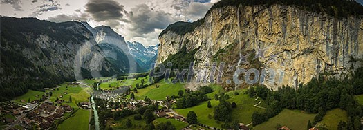 Pretty, female climber on a via ferrata - climbing on a rock in Swiss Alps Pretty, female climber on a via ferrata - climbing on a rock in Swiss Alps