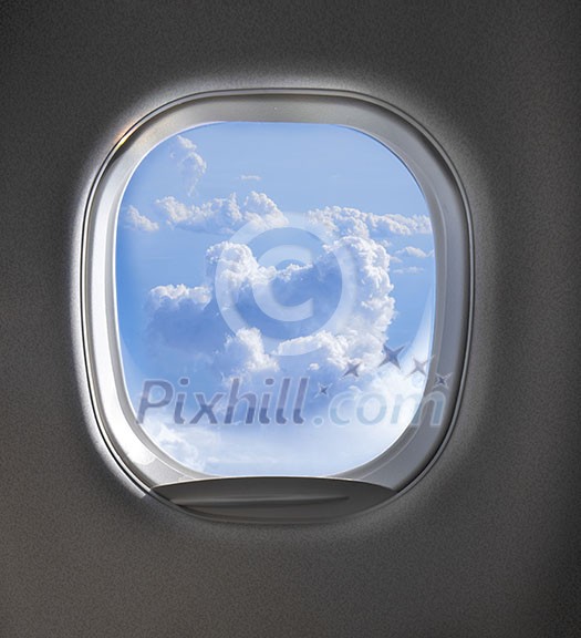 Lighted cloudy clear sky view through aircraft window with copy space. Travel and transportation concept.