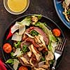 Salad with warm beef with oyster mushrooms, tomatoes and greens. Top view.