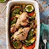 Ratatouille with chicken and pesto. French cuisine. Rosemary chicken with oven-roasted ratatouille. Top view.