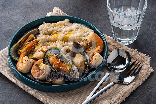 Risotto with seafood. Rice with shrimps and mussels. Mediterranean cuisine.