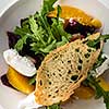 Salad with dried beetroot, apple, orange and soft goat cheese