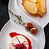 Baked Brie cheese with honey and thyme. Served with Cumberland Sauce and Crunchy Croutons
