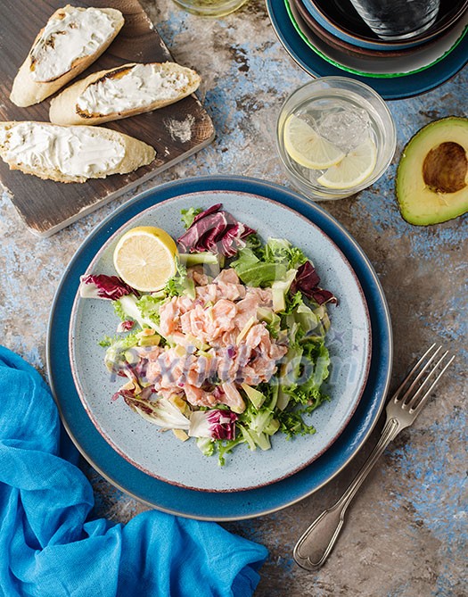 Ceviche is a traditional dish from Peru. Salmon marinated in lemon with fresh lettuce, avocado and onions. Peruvian food. Ceviche is a traditional dish from Peru. Salmon marinated in lemon with fresh lettuce, avocado and onions. Peruvian food.