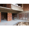 construction site interior of new two levels apartment with windows and red brick walls  construction site in progress to new house