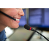 Call centre  employee communicating over phone using an external microphone for better sounf and ergonomics