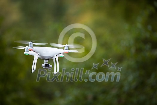 Quadrocopter drone with the camera in flight Quadrocopter drone with the camera in flight