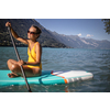 SUP Stand up paddle board concept - Pretty, young woman paddle boarding on a lovely lake in warm late afternoon light - shot from underwater