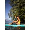 SUP Stand up paddle board concept - Pretty, young woman paddle boarding on a lovely lake in warm late afternoon light - shot from underwater