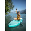 SUP Stand up paddle board concept - Pretty, young woman paddle boarding on a lovely lake in warm late afternoon light - shot from underwater