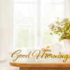 Good Morning 3D text standing on wooden kitchen table top with blurred background showing breakfast tablewear, windowframe and a vase filled with garden flowers. Space for text.